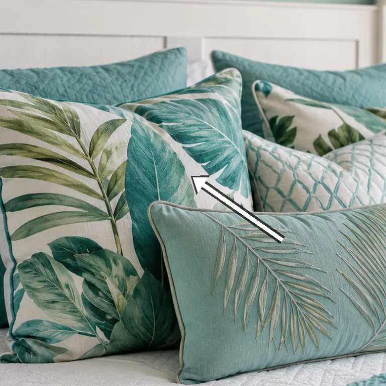 Lamps flanking the headboard with framed sea-plant prints